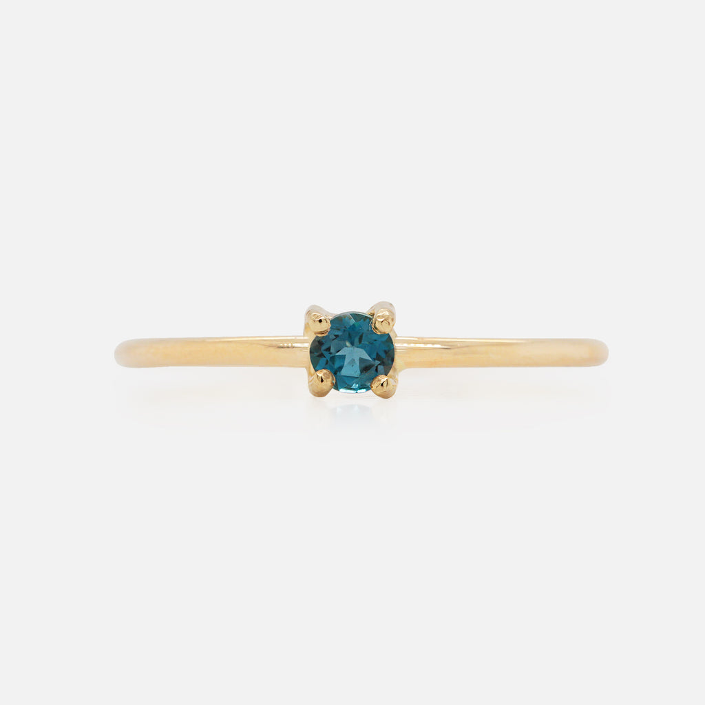 Anillo Birthstone Oro Amarillo 14K y Topacio London Blue.