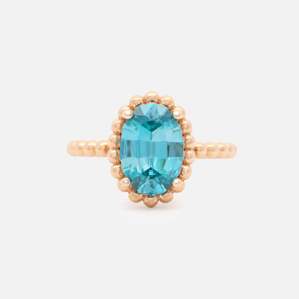 Anillo Elysa Oro Amarillo 14K con Zircón Celeste Oval.