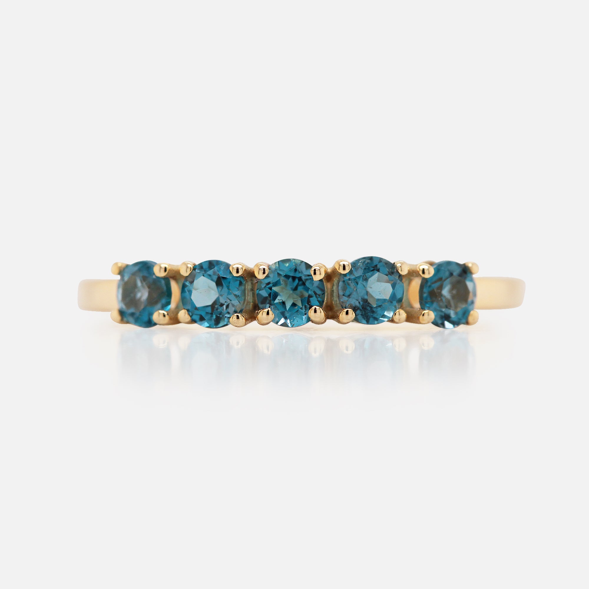 Anillo Iris Oro Amarillo 14K con Topacios London Blue.