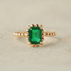 Anillo Elysa Esmerlada M Oro Amarillo 14K con Esmeraldas.