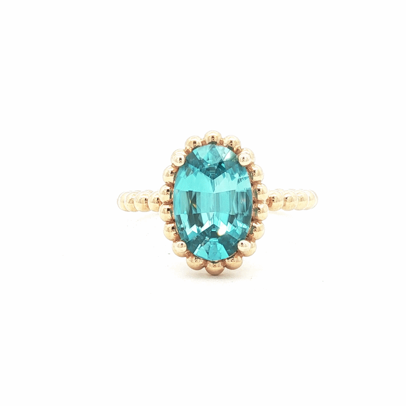 Anillo Elysa Oro Amarillo 14K con Zircón Celeste Oval.