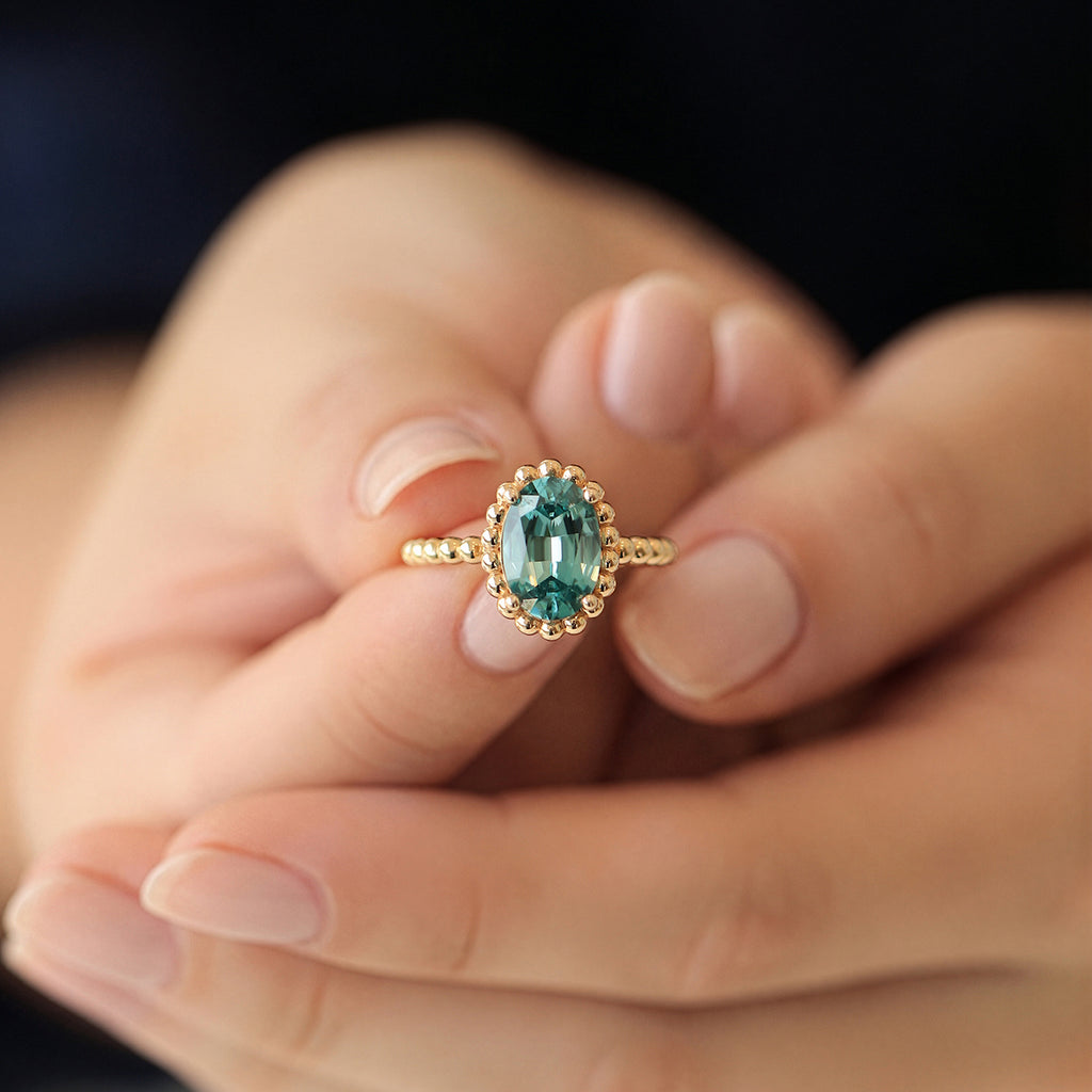 Anillo Elysa Oro Amarillo 14K con Zircón Celeste Oval.