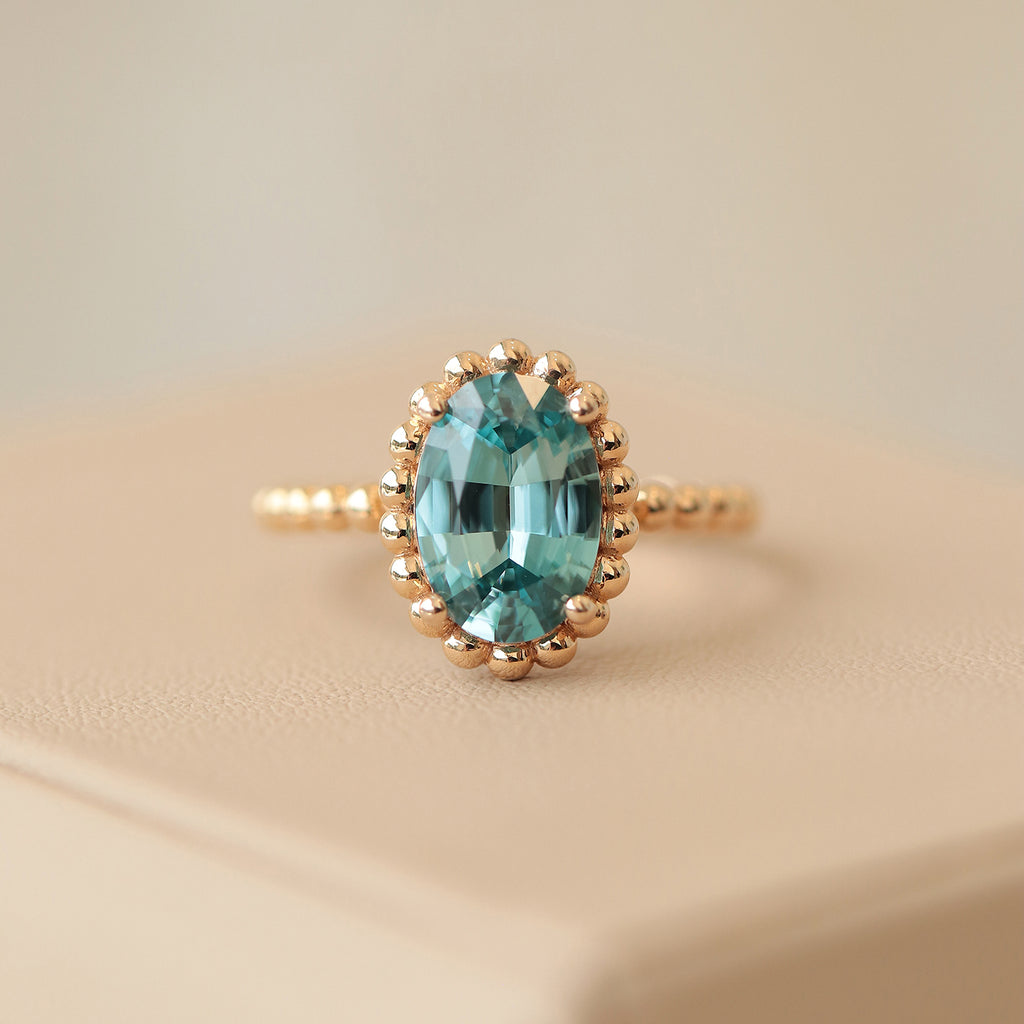 Anillo Elysa Oro Amarillo 14K con Zircón Celeste Oval.