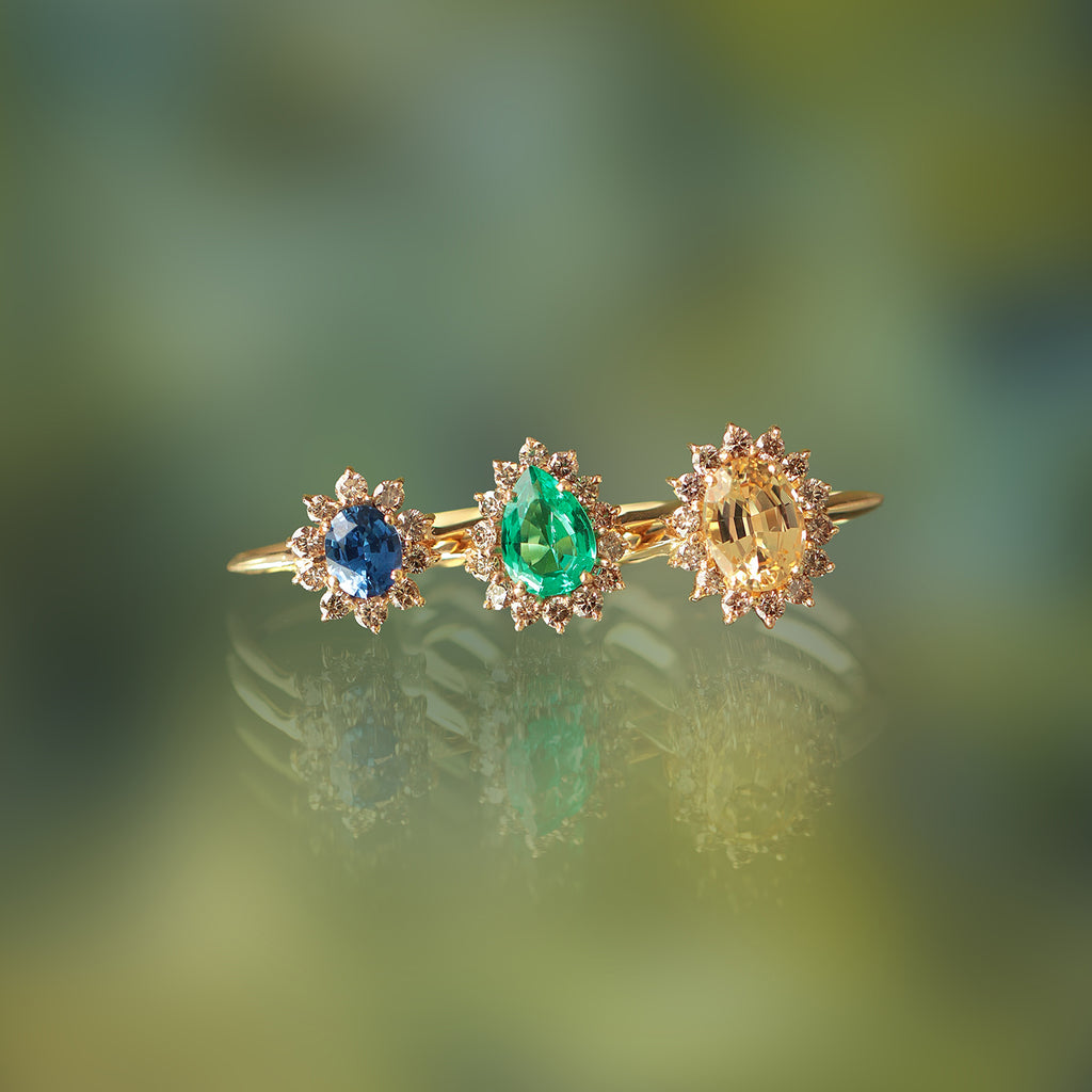 Anillo Imperial Oro Amarillo 14K con Esmeralda y Diamantes Champagne.