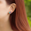 Aretes Botanical Lily Oro Amarillo 14K con Tanzanitas, Amatistas, Zafiros, Rubíes y Ópalos.