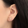 Aretes Nest Flat Oro Amarillo 18K con Zirconias.
