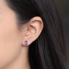 Aretes Orbit Oro Amarillo 14K con Tanzanitas Oval.