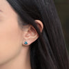 Aretes Orbit Oro Amarillo 14K con Topacios London Blue Trillón.