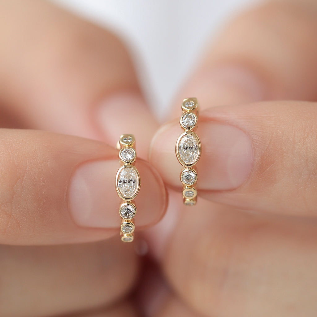 Arracadas Apolo Oro 14K con Diamante Central Oval.