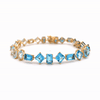 Brazalete Gradient Blue Oro Amarillo 18K con Topacios.