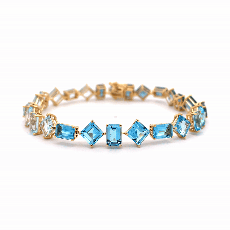 Brazalete Gradient Blue Oro Amarillo 18K con Topacios.