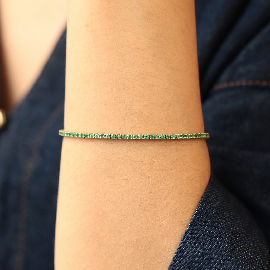 Brazalete Tennis Oro Amarillo 14K con Esmeraldas.