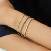 Brazalete Tennis Oro Amarillo 14K con Esmeraldas.