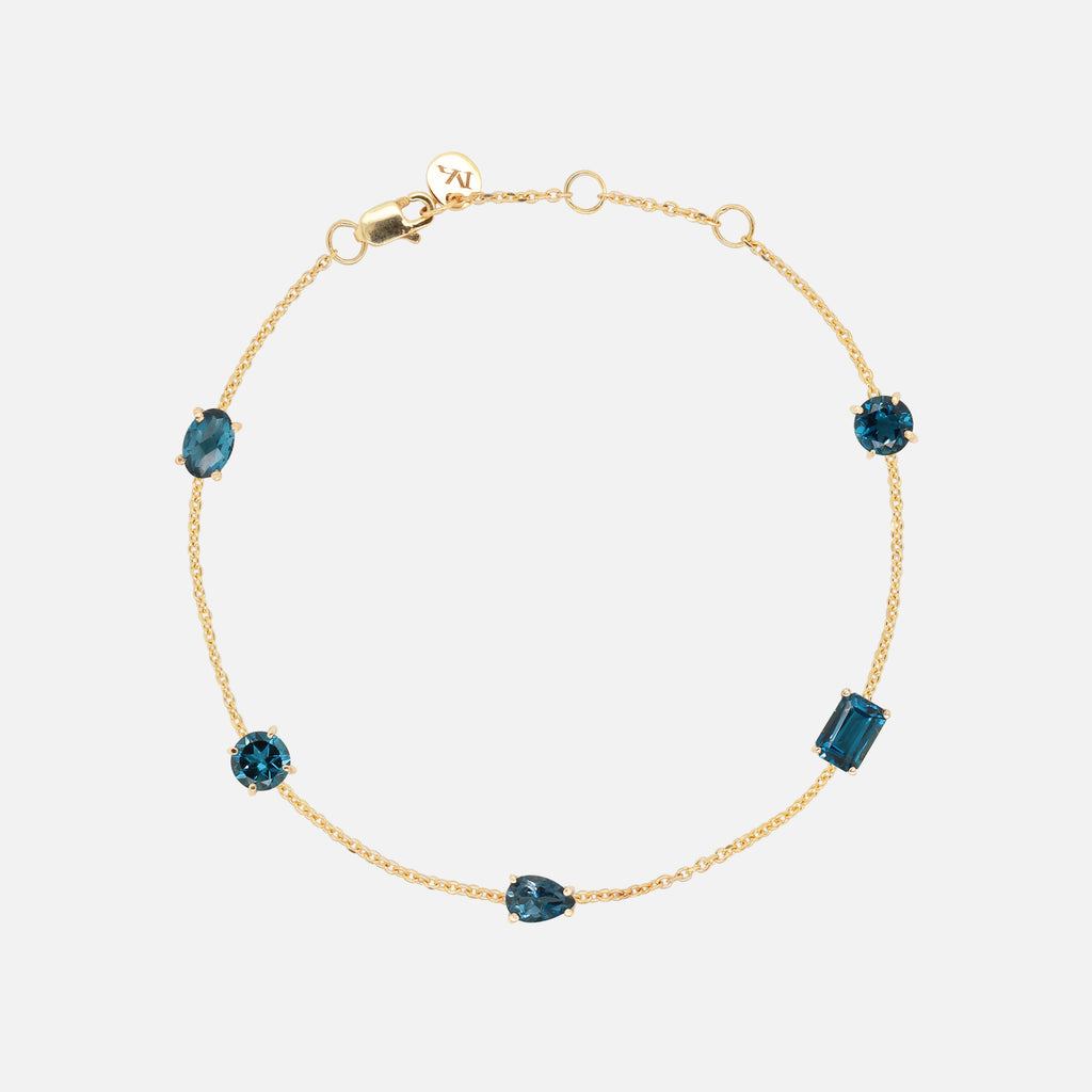 Brazalete Birthstone Oro Amarillo 14K con Topacio London Blue.